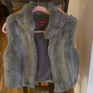 Warm, stylish fur vest.... just too big for me.